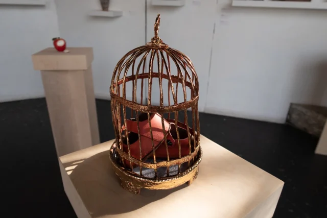 Shoes in a gilded cage, all ceramic