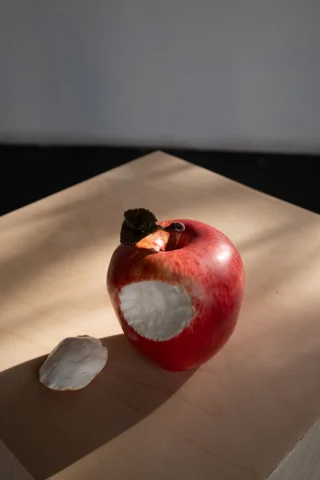 Ceramic apple with a bite taken out of it